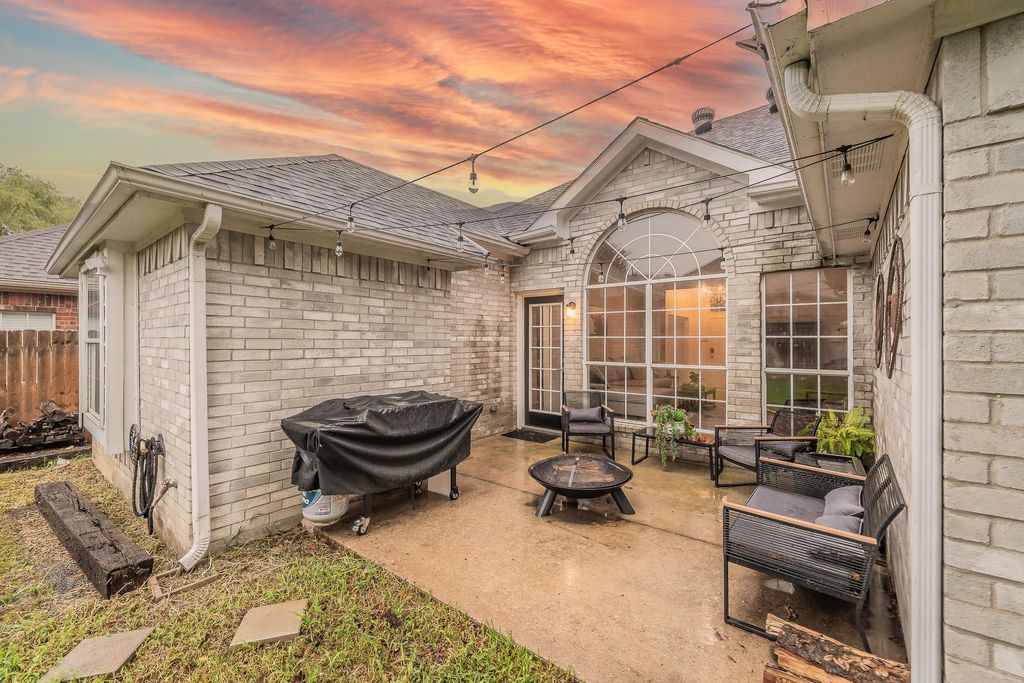 View of patio / terrace featuring an outdoor fire pit and grilling area