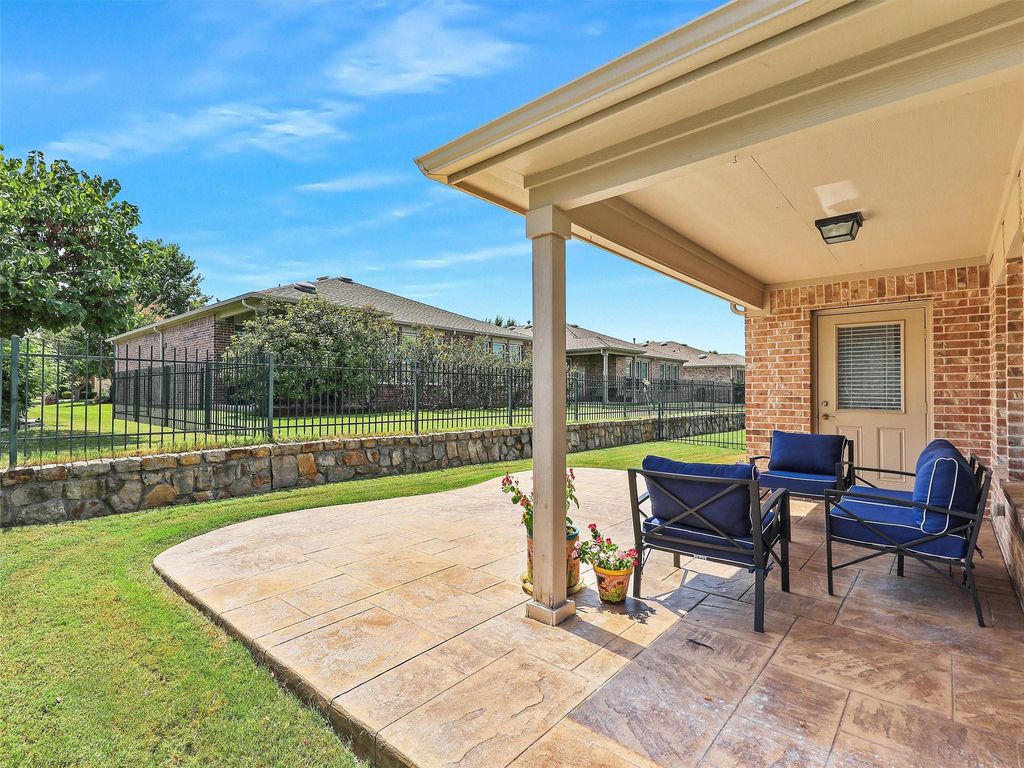 Fenced backyard featuring a patio area and an outdoor living space
