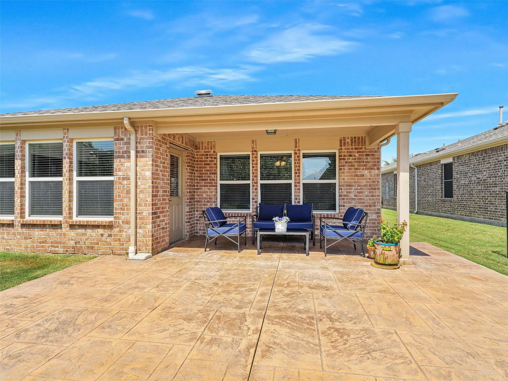 View of patio with an outdoor hangout area