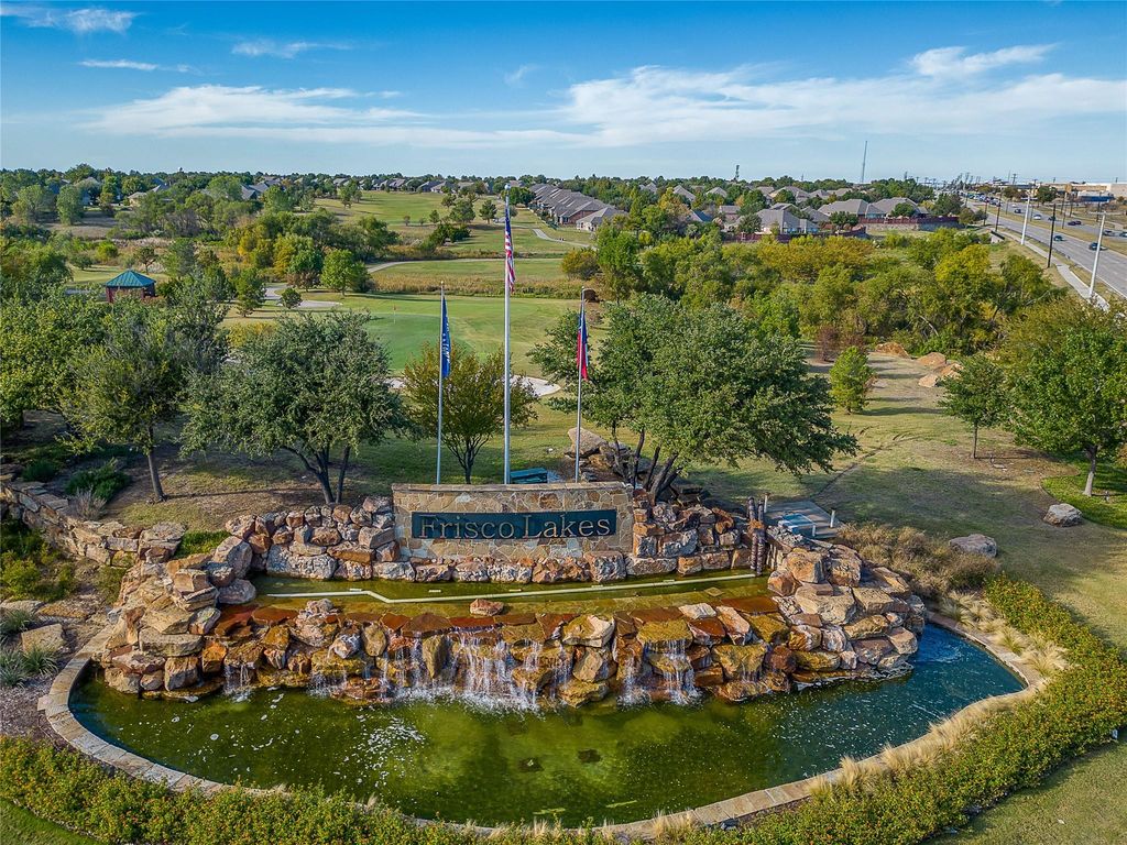 View of property location with a tree filled landscape