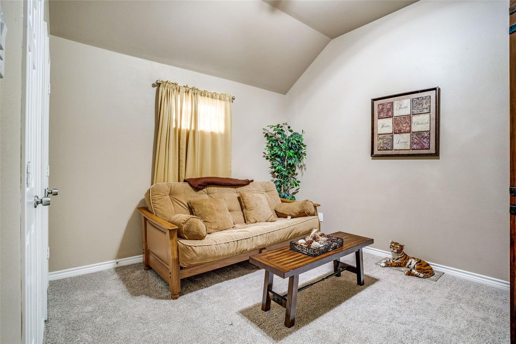Carpeted bedroom with lofted ceiling