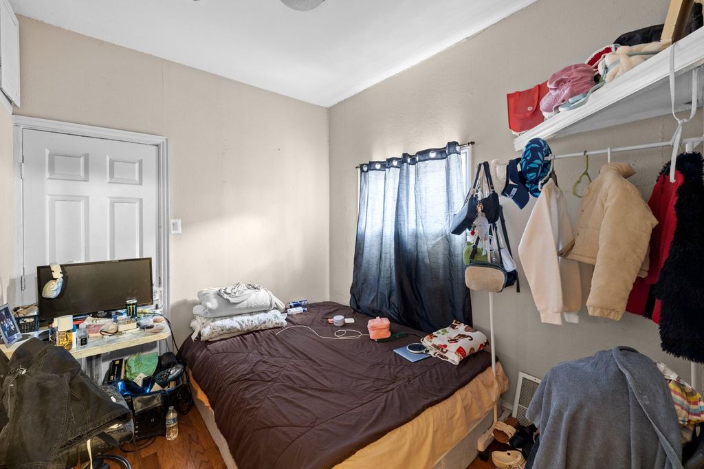 Bedroom with wood finished floors