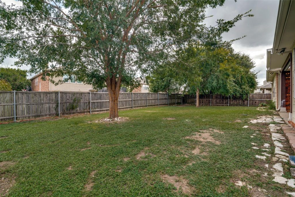 View of fenced backyard