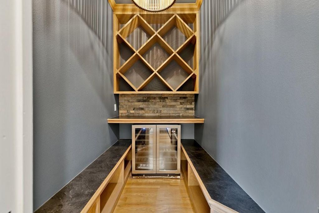 Custom wine room with refrigerator