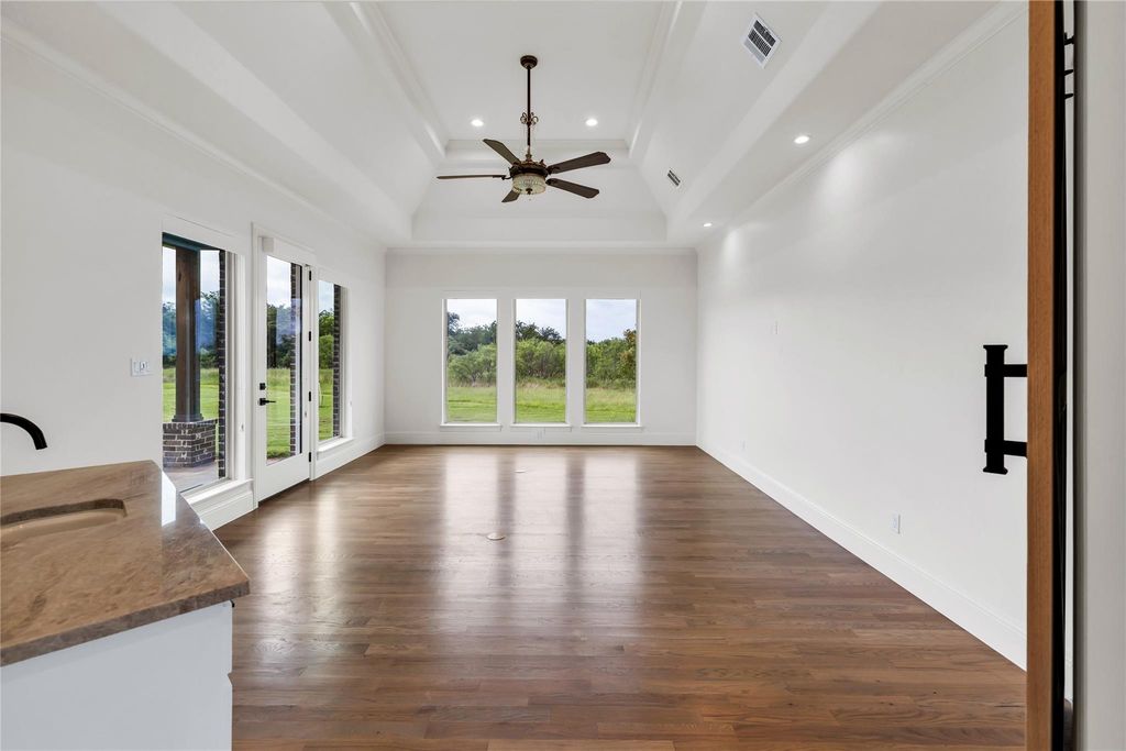 Game or Movie Room w/ Sink & Outdoor Entrance to Covered Patio