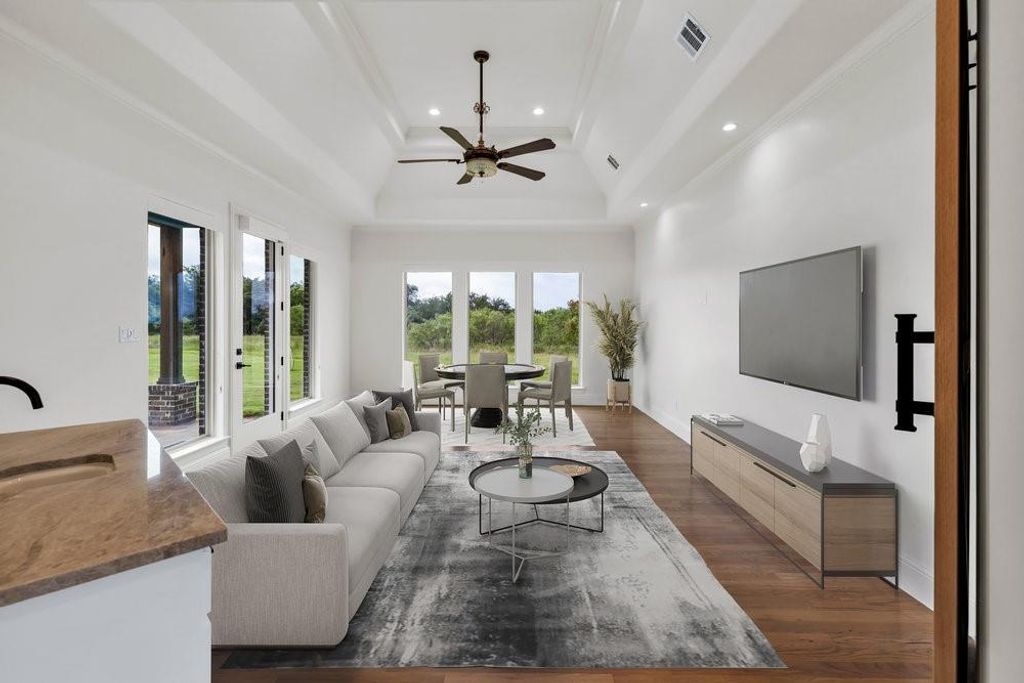Virtually Staged Game or Movie Room w/ Sink & Outdoor Entrance to Covered Patio