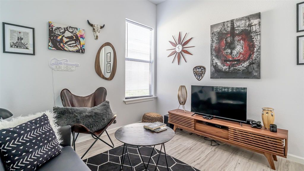 Living area featuring wood finished floors and baseboards