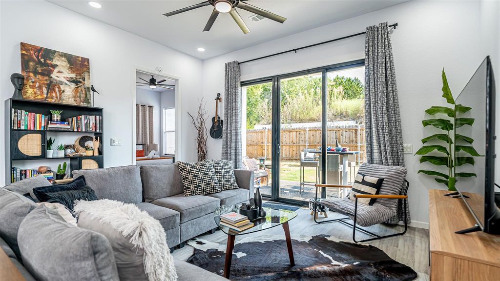 Living room featuring ceiling fan, wood finished floors, and recessed lighting