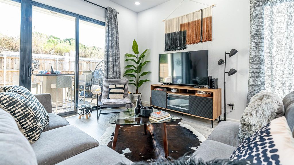 Living area featuring wood finished floors and recessed lighting