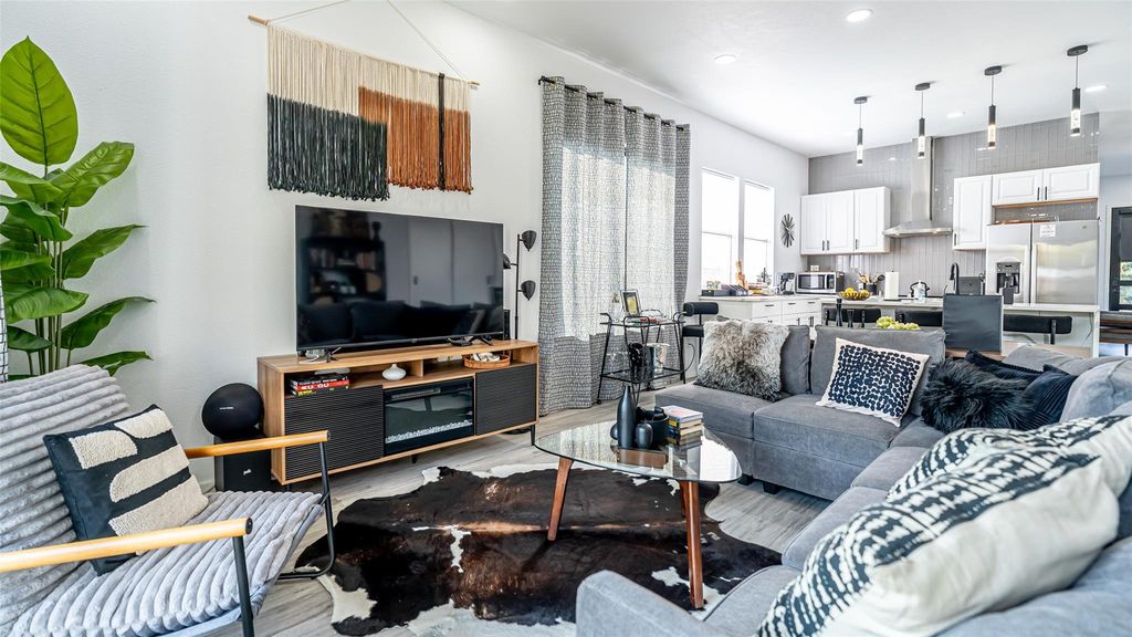 Living room with wood finished floors and recessed lighting