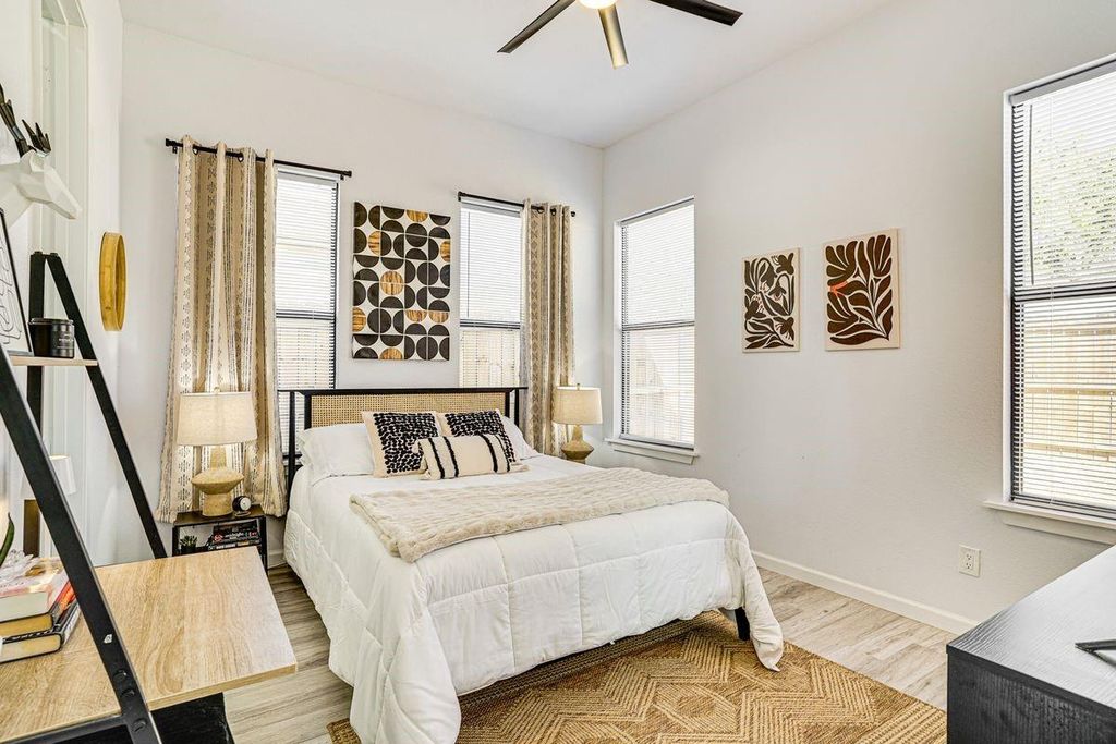 Bedroom featuring wood finished floors and ceiling fan