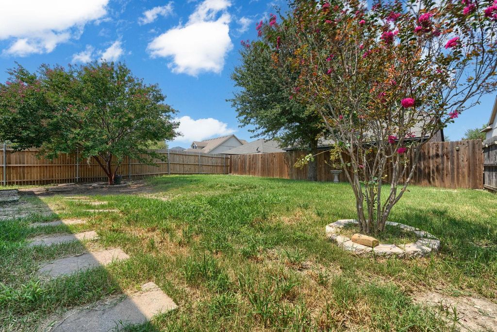 View of fenced backyard