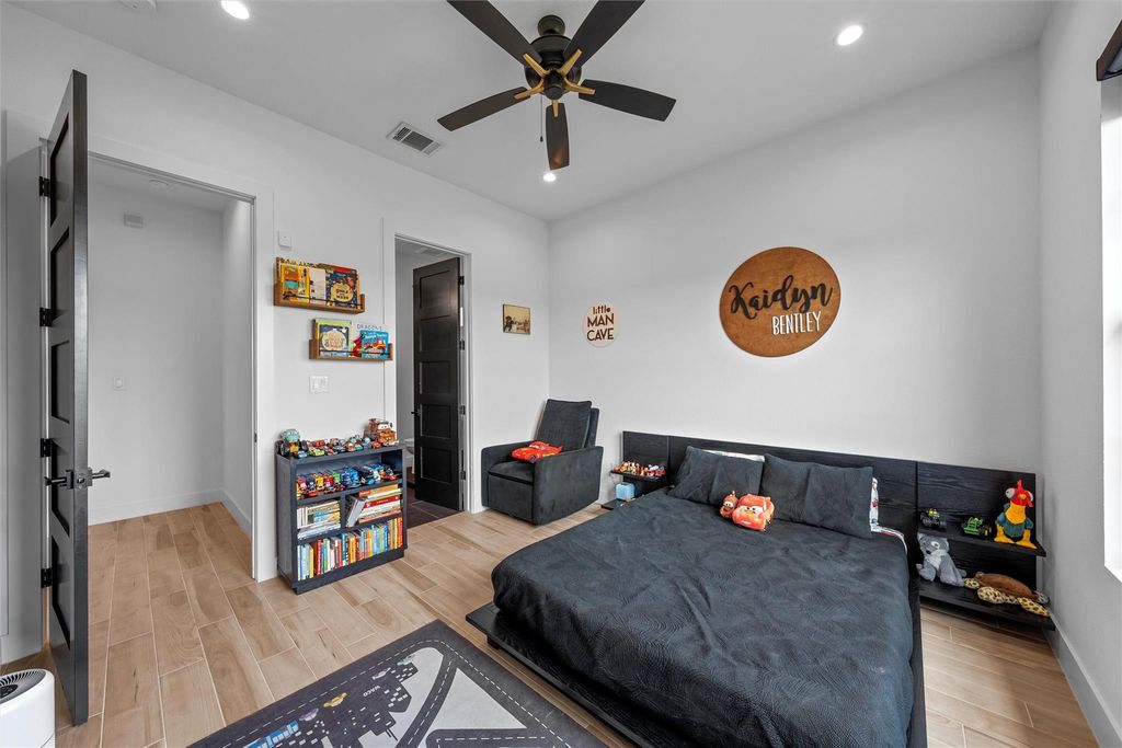Bedroom with wood tiled floors, recessed lighting, and ceiling fan