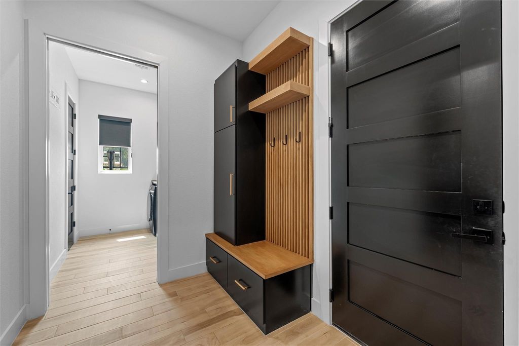 Mudroom with light wood finished floors, recessed lighting, and washing machine and dryer