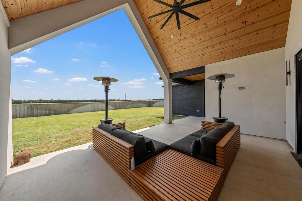 Fenced backyard with a patio area and an outdoor living space