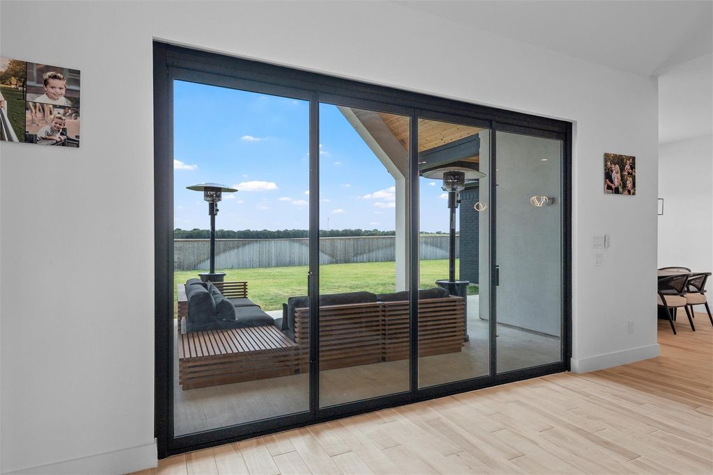 Doorway with wood finished floors and a water view