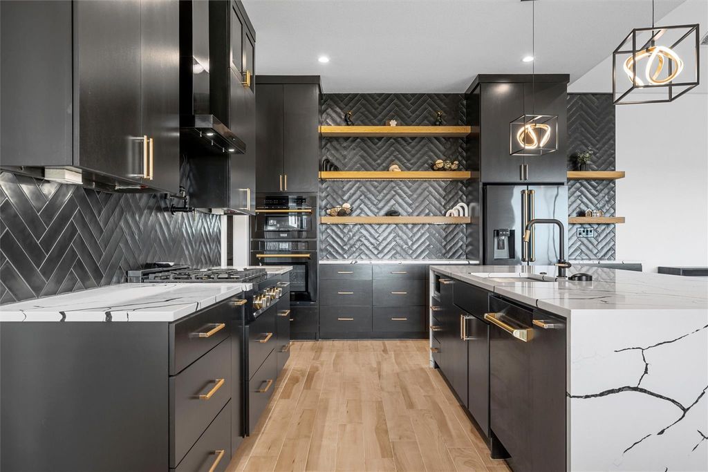 Kitchen featuring pendant lighting, light stone countertops, dark cabinetry, open shelves, and light wood-type flooring