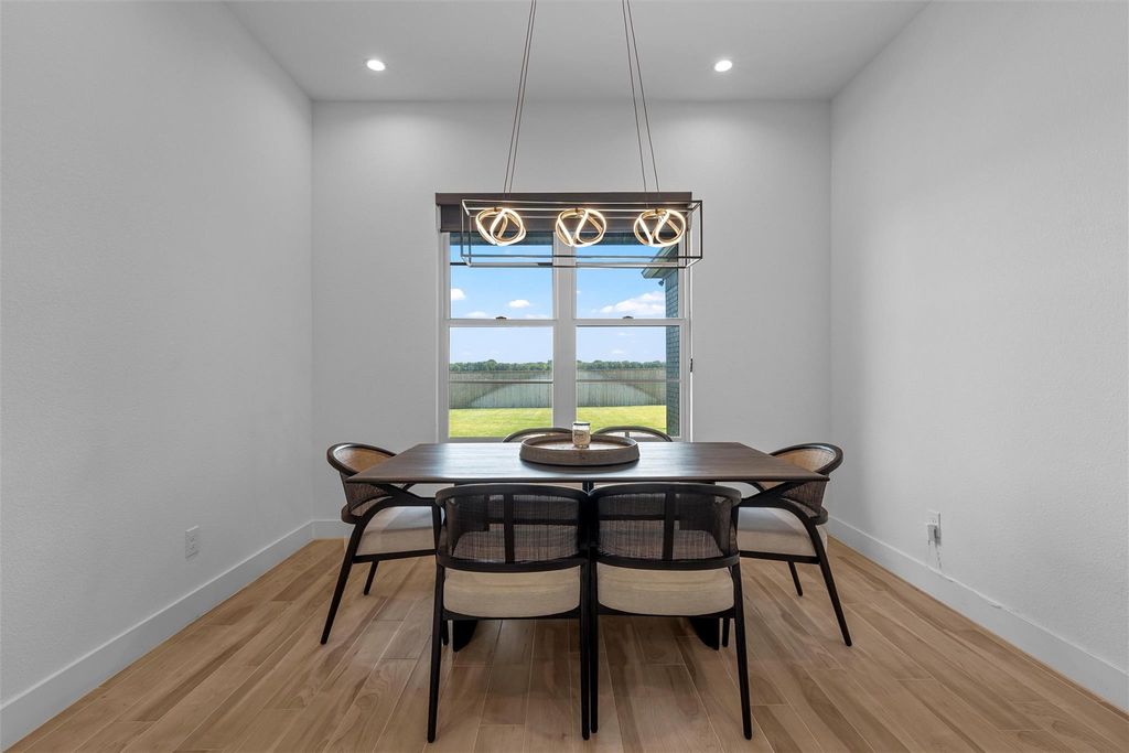 Dining area featuring light wood-style floors and recessed lighting