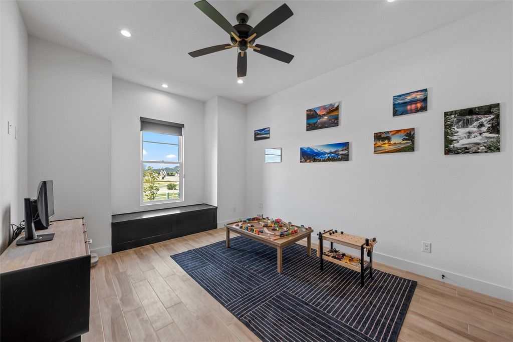 Sitting room featuring light wood finished floors, recessed lighting, and ceiling fan