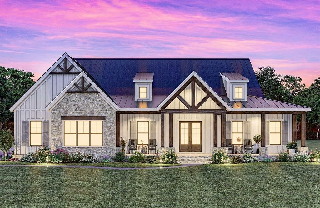View of front of home featuring covered porch, stone siding, a metal roof, a lawn, and board and batten siding