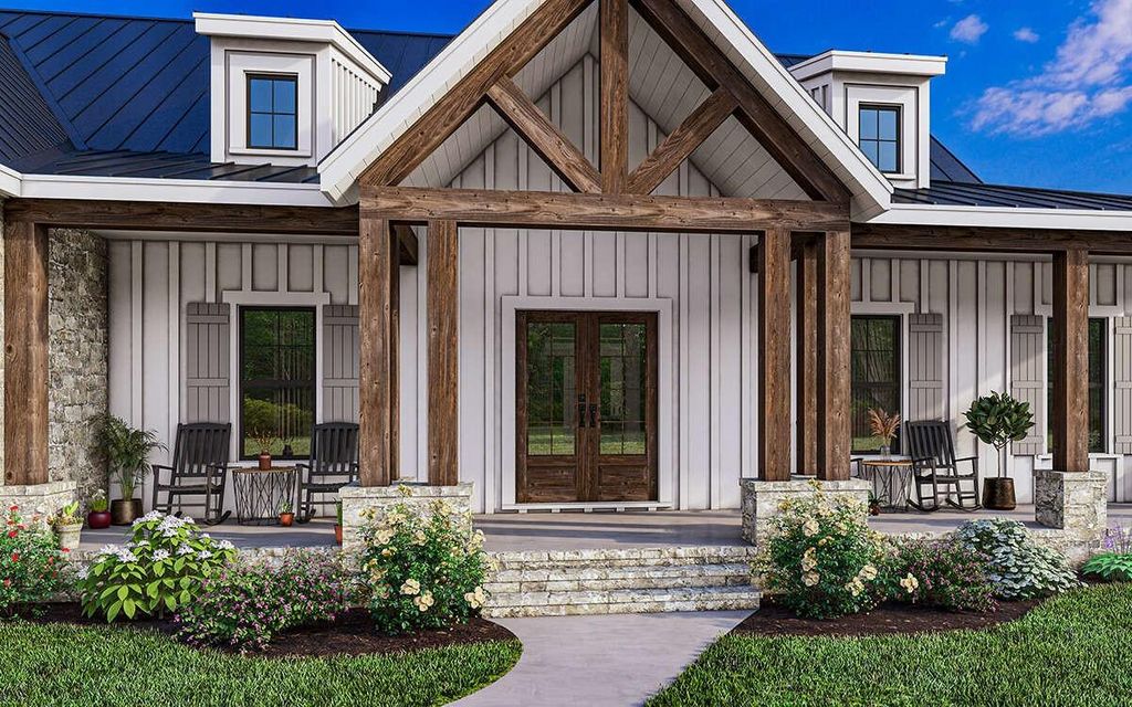 View of exterior entry with board and batten siding, a porch, a metal roof, french doors, and a standing seam roof