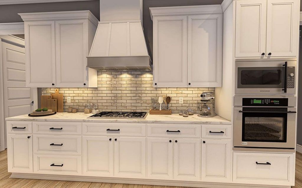 Kitchen featuring appliances with stainless steel finishes, custom range hood, decorative backsplash, and light wood-type flooring