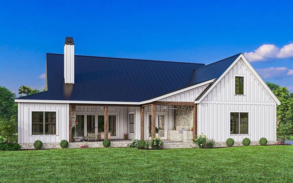 Back of property featuring board and batten siding, a porch, a yard, and a chimney