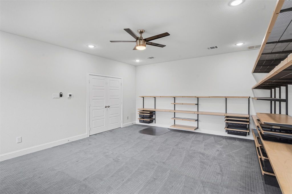 Carpeted spare room featuring recessed lighting and a ceiling fan