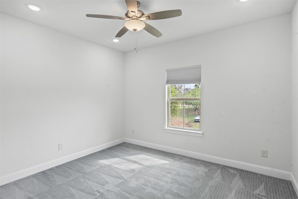 Empty room with light colored carpet, recessed lighting, and a ceiling fan