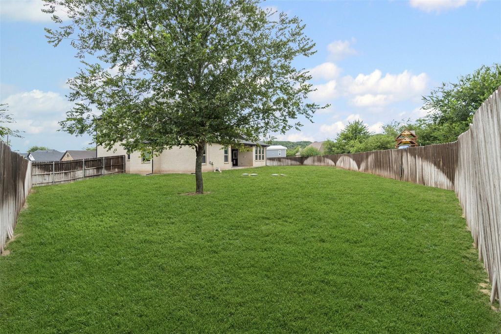 View of fenced backyard