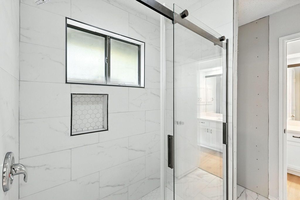 Bathroom with vanity and a stall shower