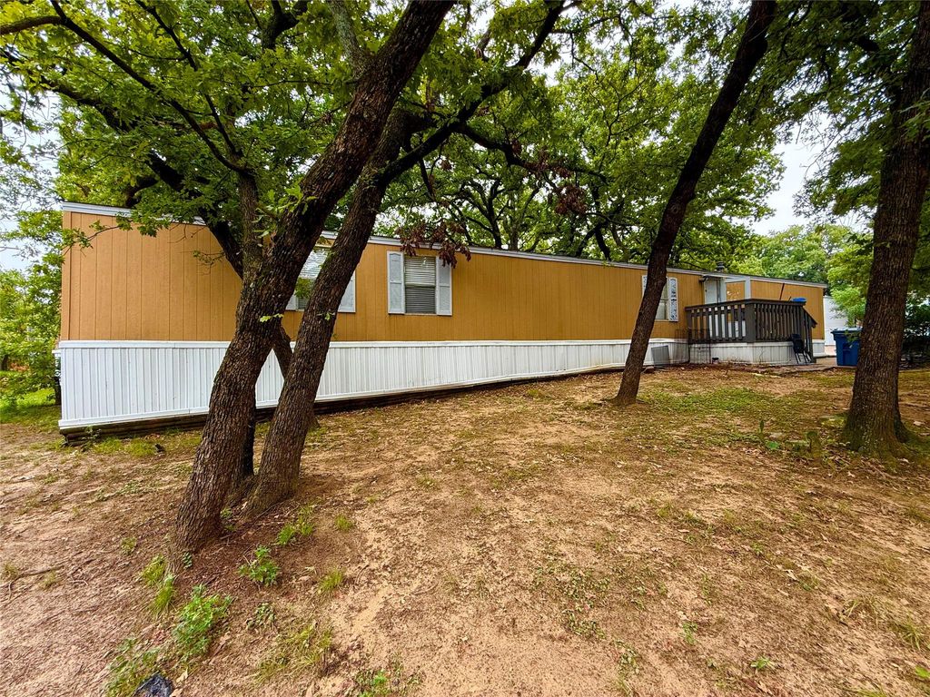 View of yard with a wooden deck