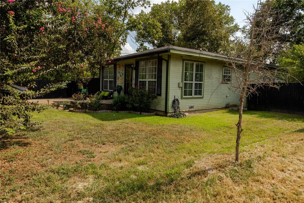 View of home's exterior with a lawn