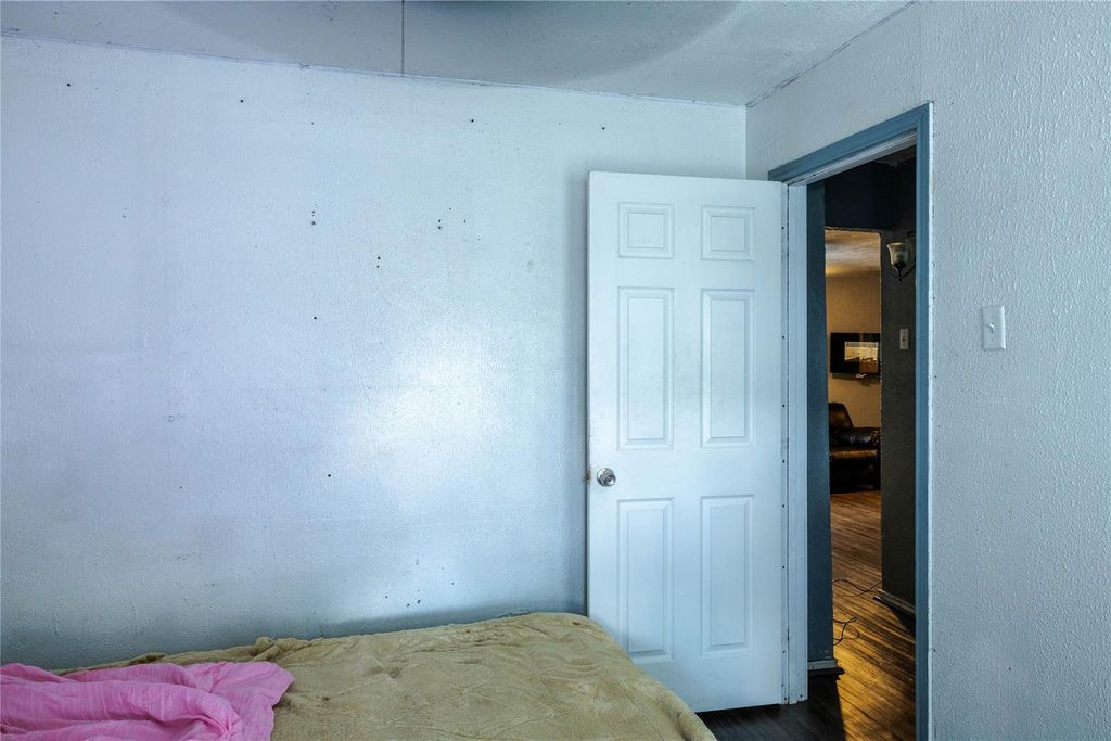 Bedroom featuring wood finished floors