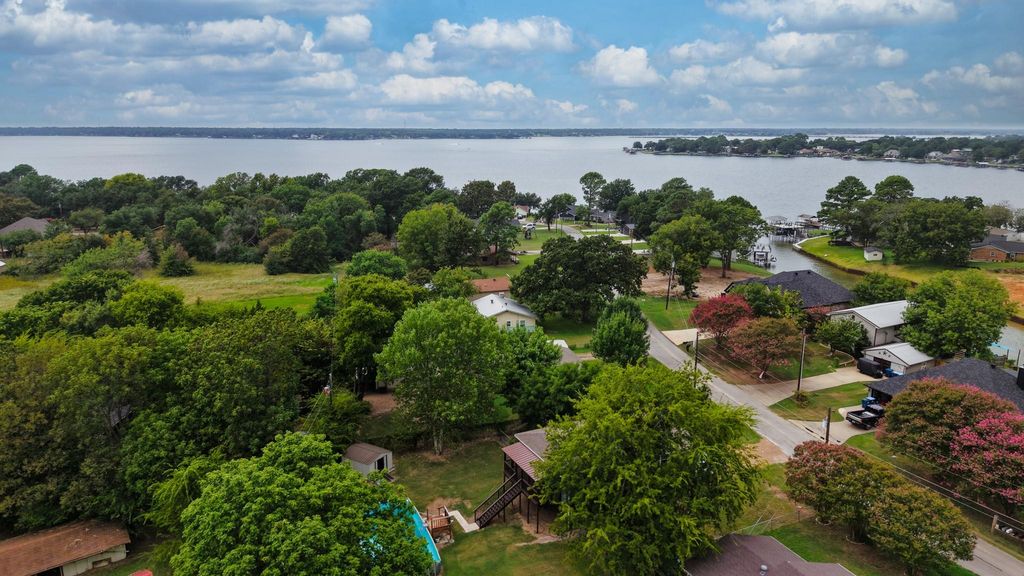 Aerial perspective of suburban area with a nearby body of water