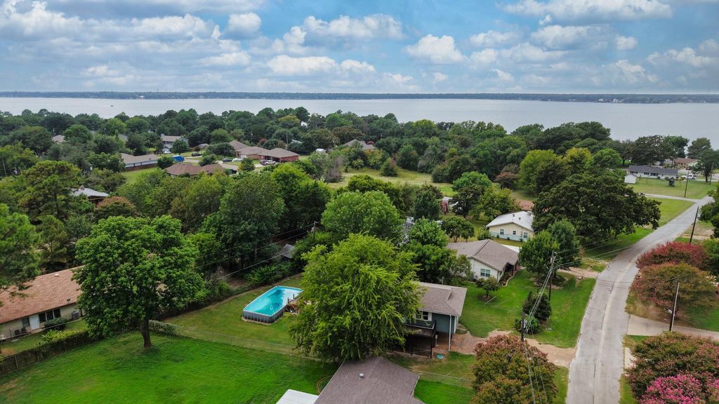 Aerial perspective of suburban area with a nearby body of water
