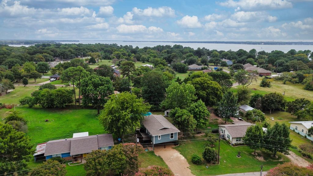 Aerial perspective of suburban area with a large body of water