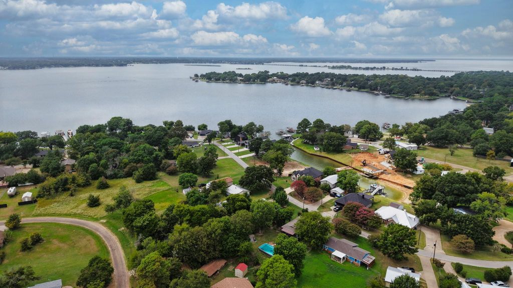 Aerial view of residential area featuring a large body of water