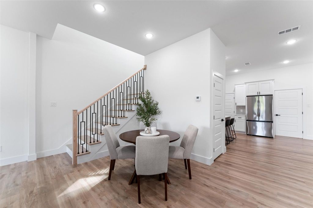 Dining room featuring light wood-style floors, stairway, and recessed lighting