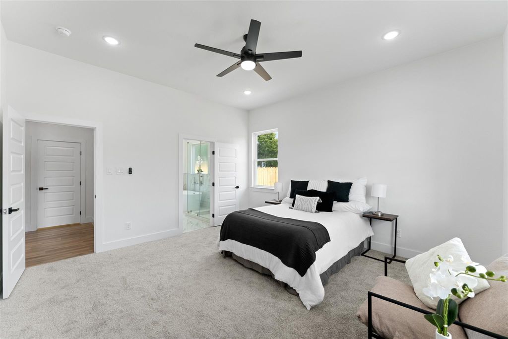 Bedroom featuring carpet flooring, ceiling fan, recessed lighting, and connected bathroom