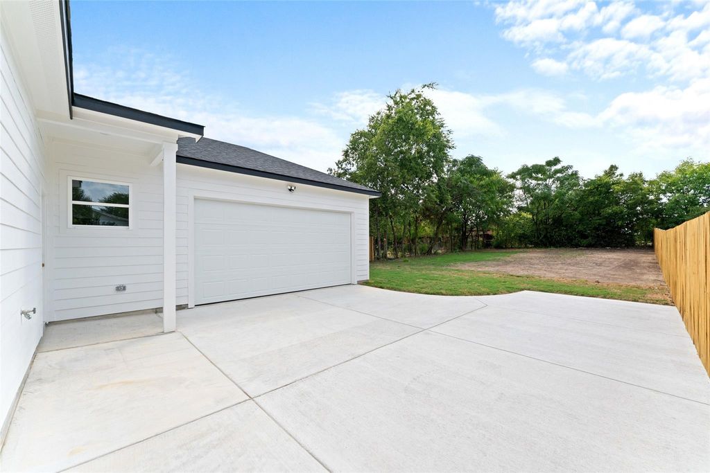 Garage with concrete driveway