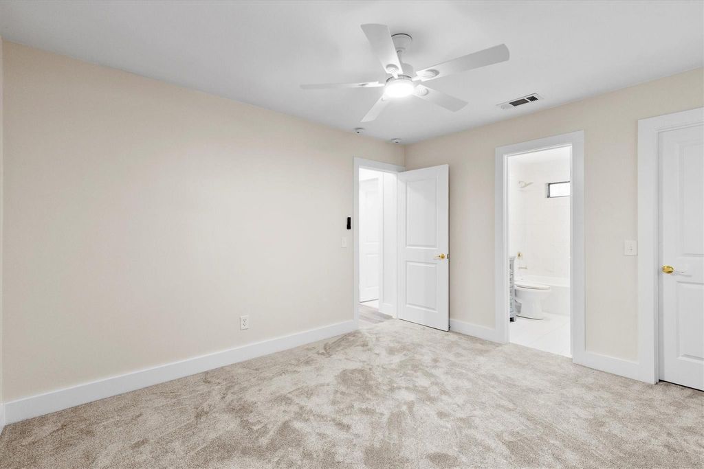 Unfurnished bedroom featuring carpet flooring and a ceiling fan