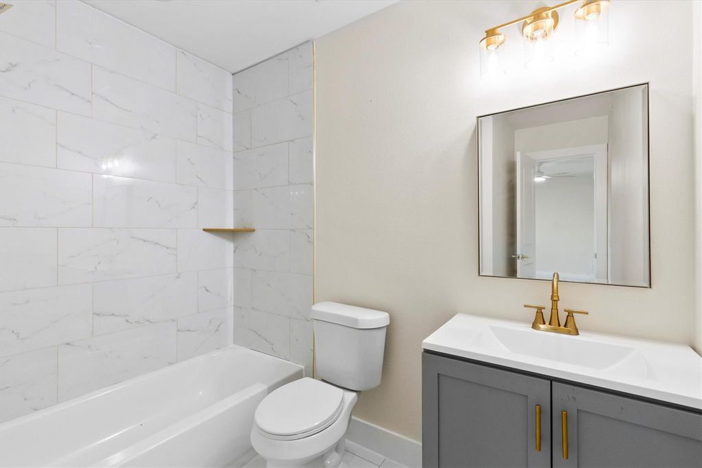 Full bath featuring vanity and tub / shower combination