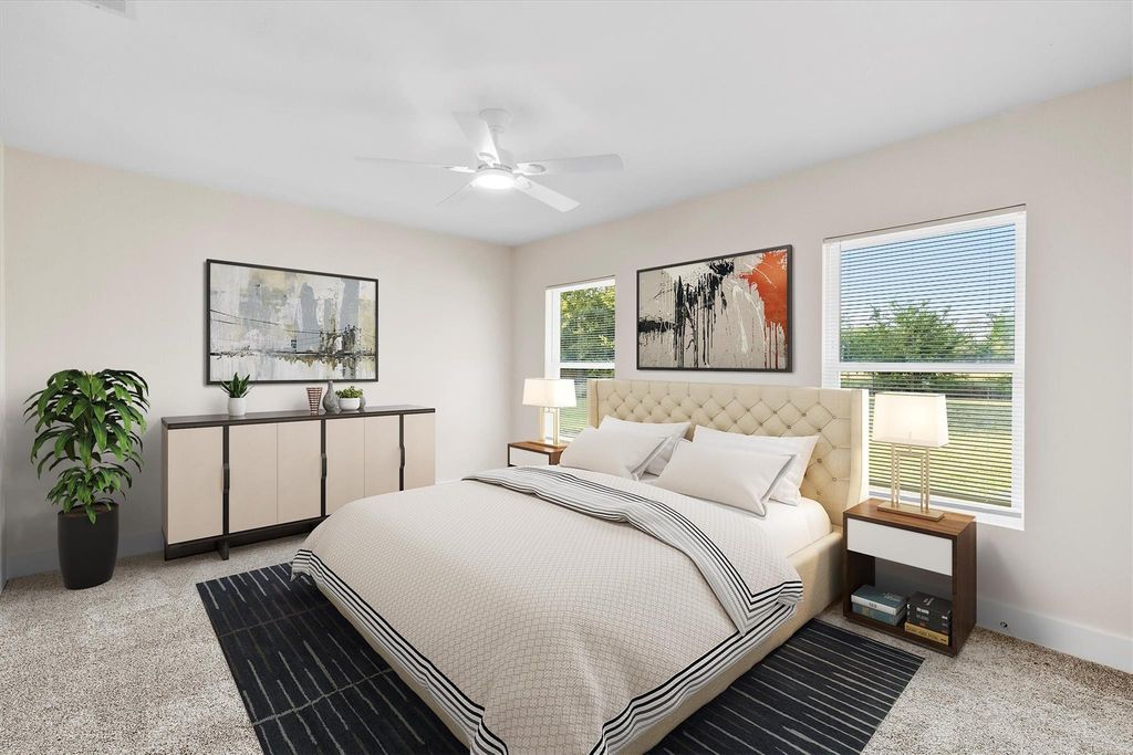 Bedroom with light colored carpet and ceiling fan