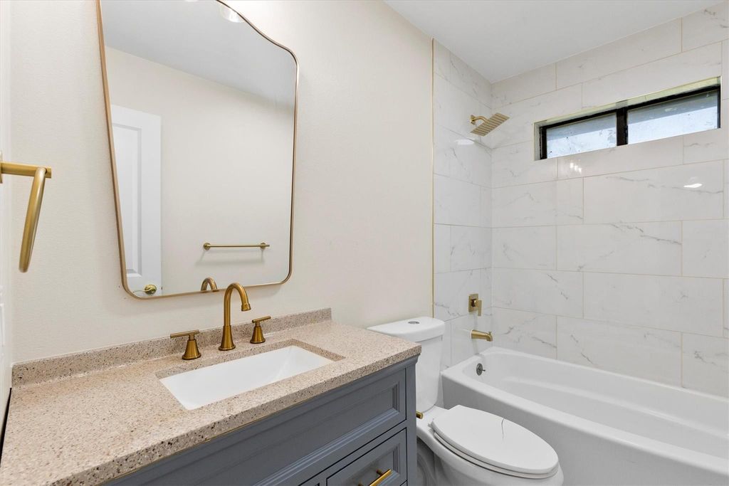 Full bathroom featuring shower / washtub combination and vanity