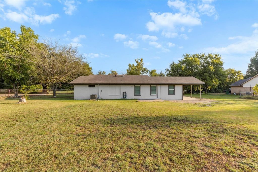 Rear view of property featuring a patio