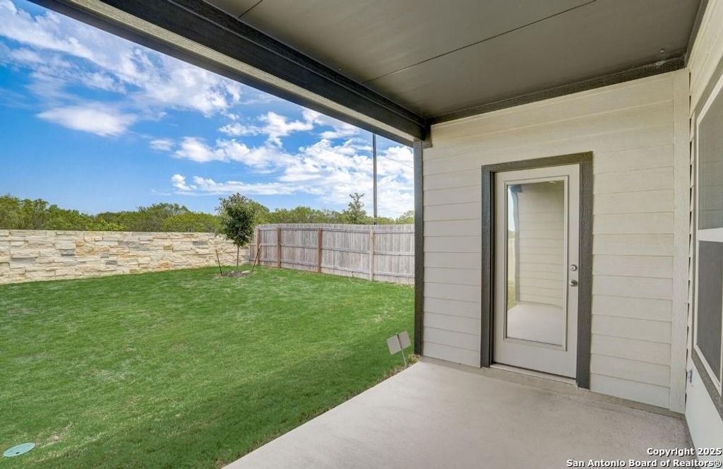 View of yard with a patio
