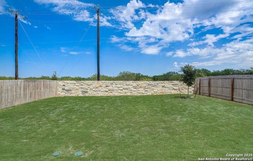 View of fenced backyard