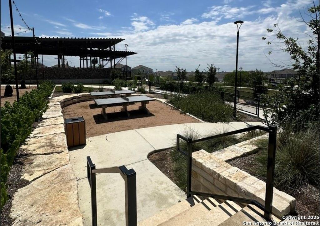 View of community featuring a patio area and a pergola
