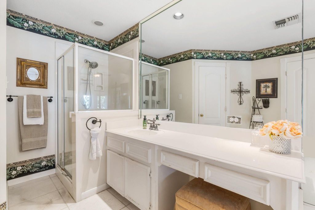 SEPARATE SHOWER AND SINK WITH VANITY.